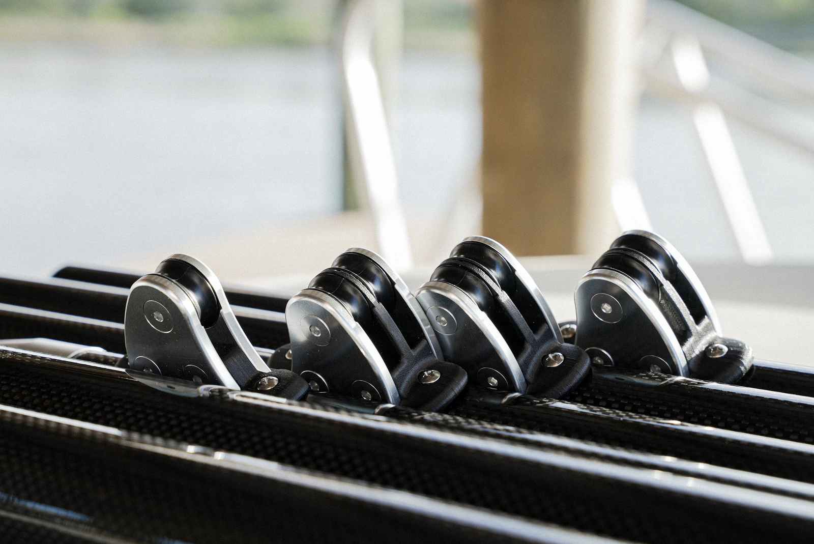 Close-up of Gemlux Bluewater carbon-fiber outrigger poles and external line-guide hardware